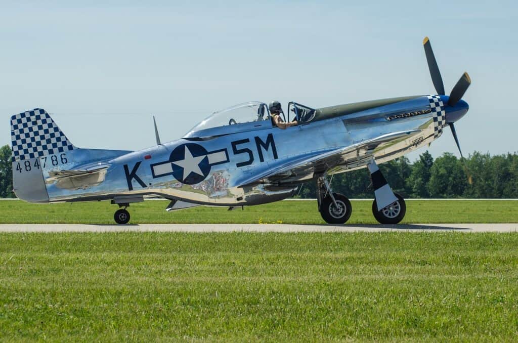 old military warbird plane outside