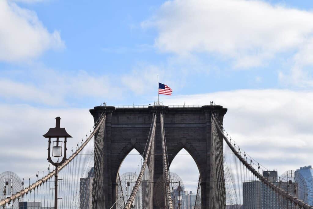 American flag on top of the Brooklyn Bridge
