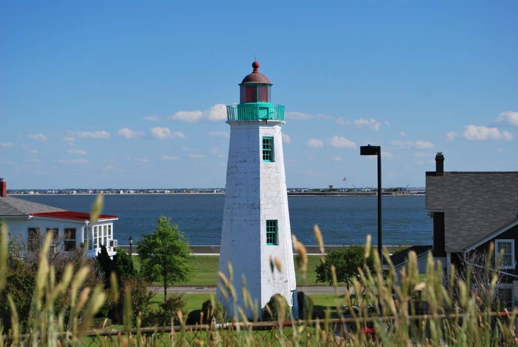 daylight view of lighthouse with ocean in the background in Hampton, Virginia